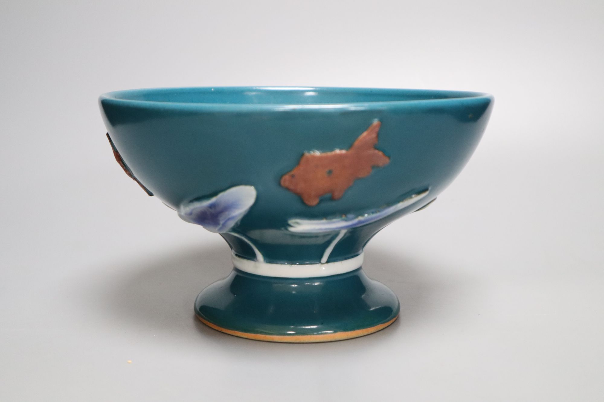 An Asian green glazed lotus pedestal bowl, diameter 22cm height 12.5cm